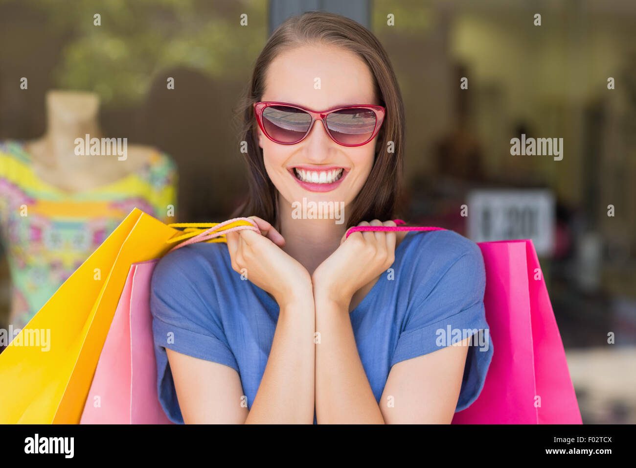 Happy woman carrying shopping bags Stock Photo Alamy