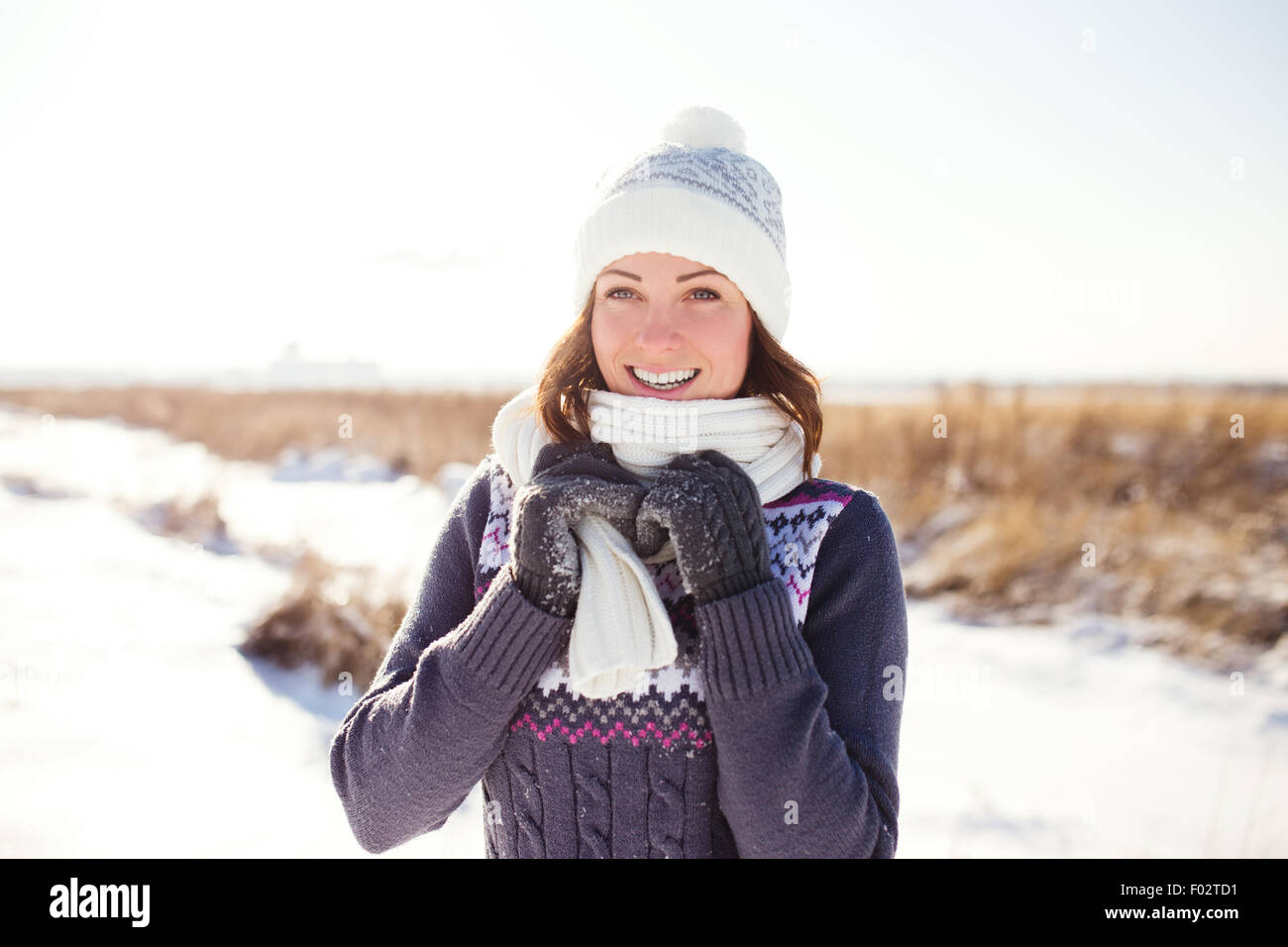 Portrait of happy young woman have fun at beautiful sunny winter day Stock Photo