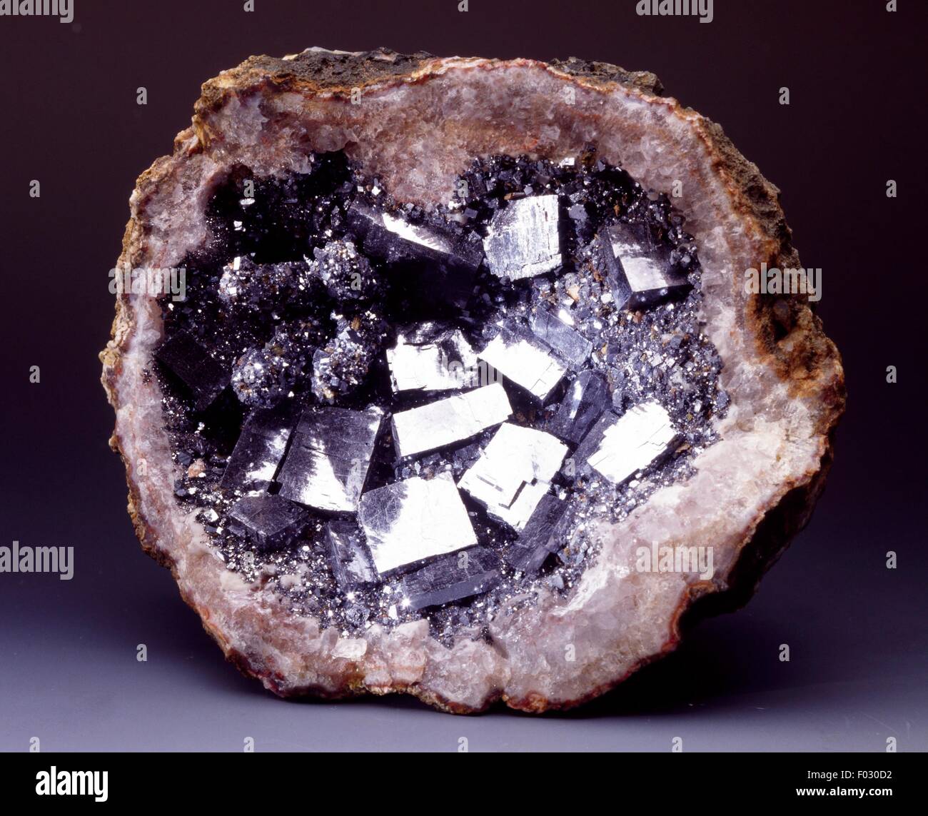 Galena pasted into Quartz geode, fake minerals, from Morocco. Stock Photo