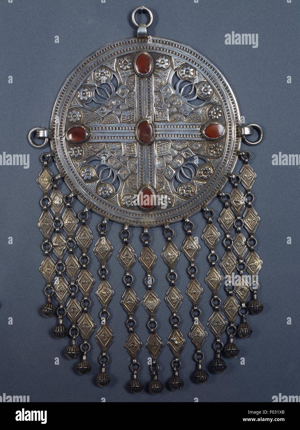 Partially fire-gilded silver pendant and carnelian, Yomut Turkmen, Central Asia. Stock Photo