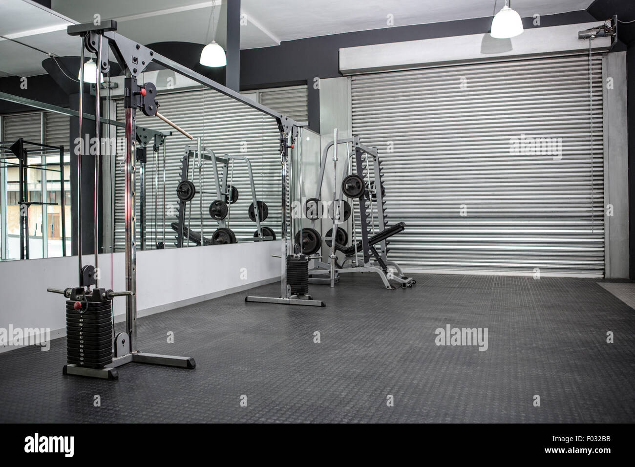 Exercise room with shutters and mirrors Stock Photo Alamy
