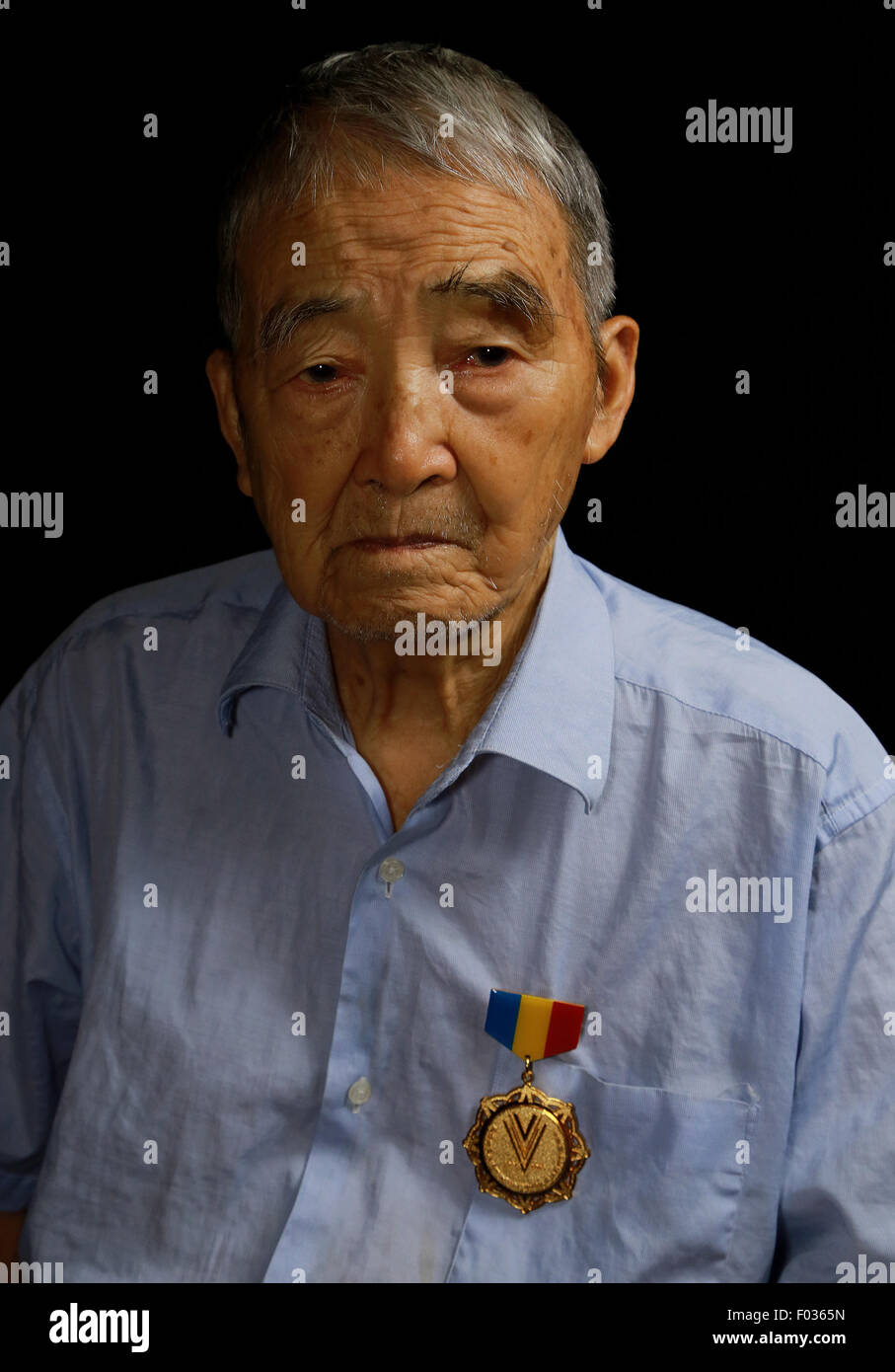 Chn. 24th Aug, 2014. CHINA - August 24 2014: (EDITORIAL USE ONLY. CHINA OUT)(MINIMUM PRICE: 100 USD) Li Caixiang: Male, born in 1922 and now lives in Yueyang Hunan. He joined 6th Company 2nd Battalion Practicing Regiment of Guizhou Majiang Land Force communication School to study radio communications with a few countrymen to avoid being caught for conscription in 1943. He was allocated to 3rd Squad 12th Company 3rd Battalion of Communication Regiment Guilin Guangxi, later he was promoted to be a Platoon Commander and Station Director in charge of sending and receiving telegrams. He ran back h Stock Photo