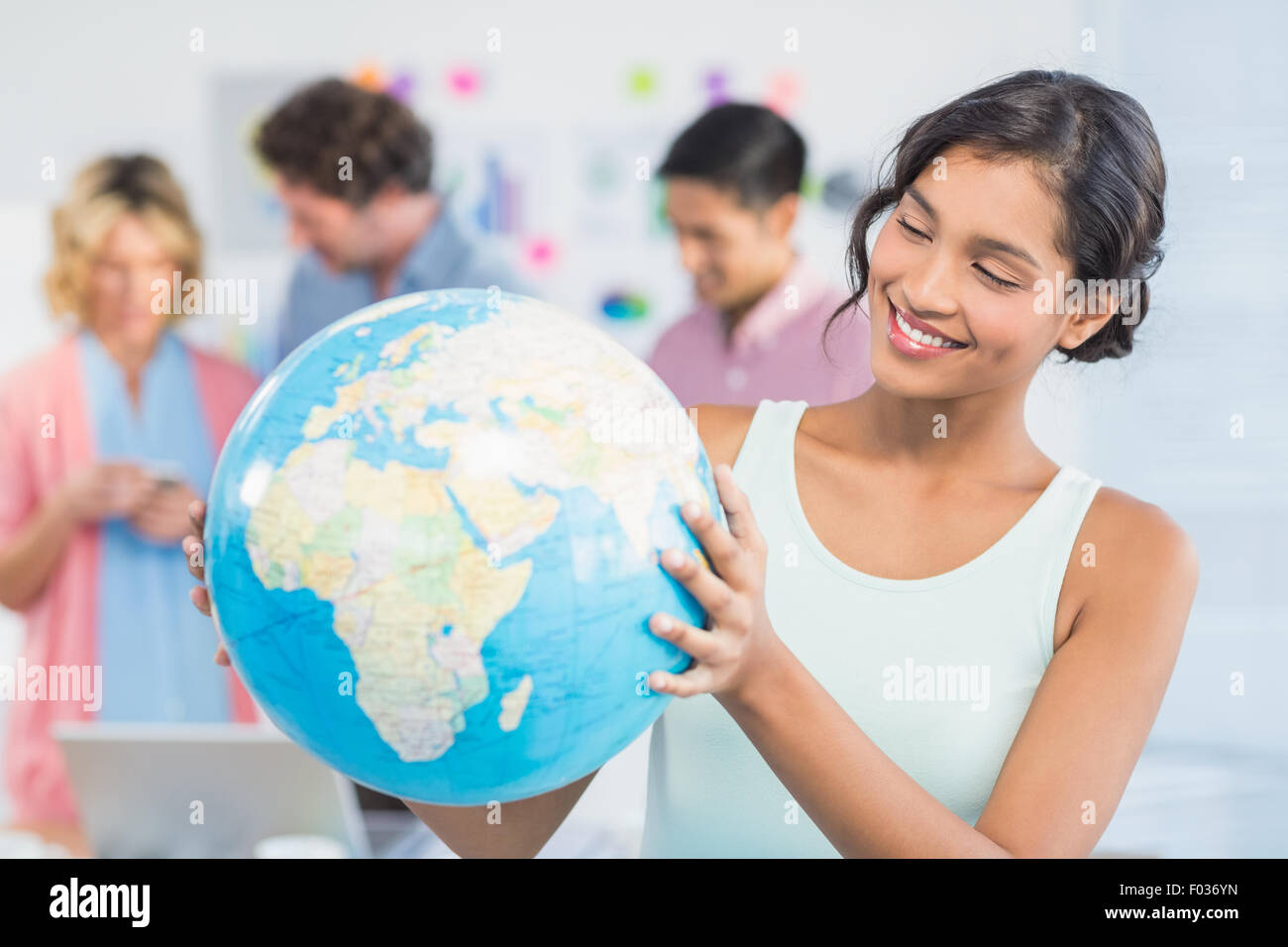 Man woman globe holding hi-res stock photography and images - Alamy