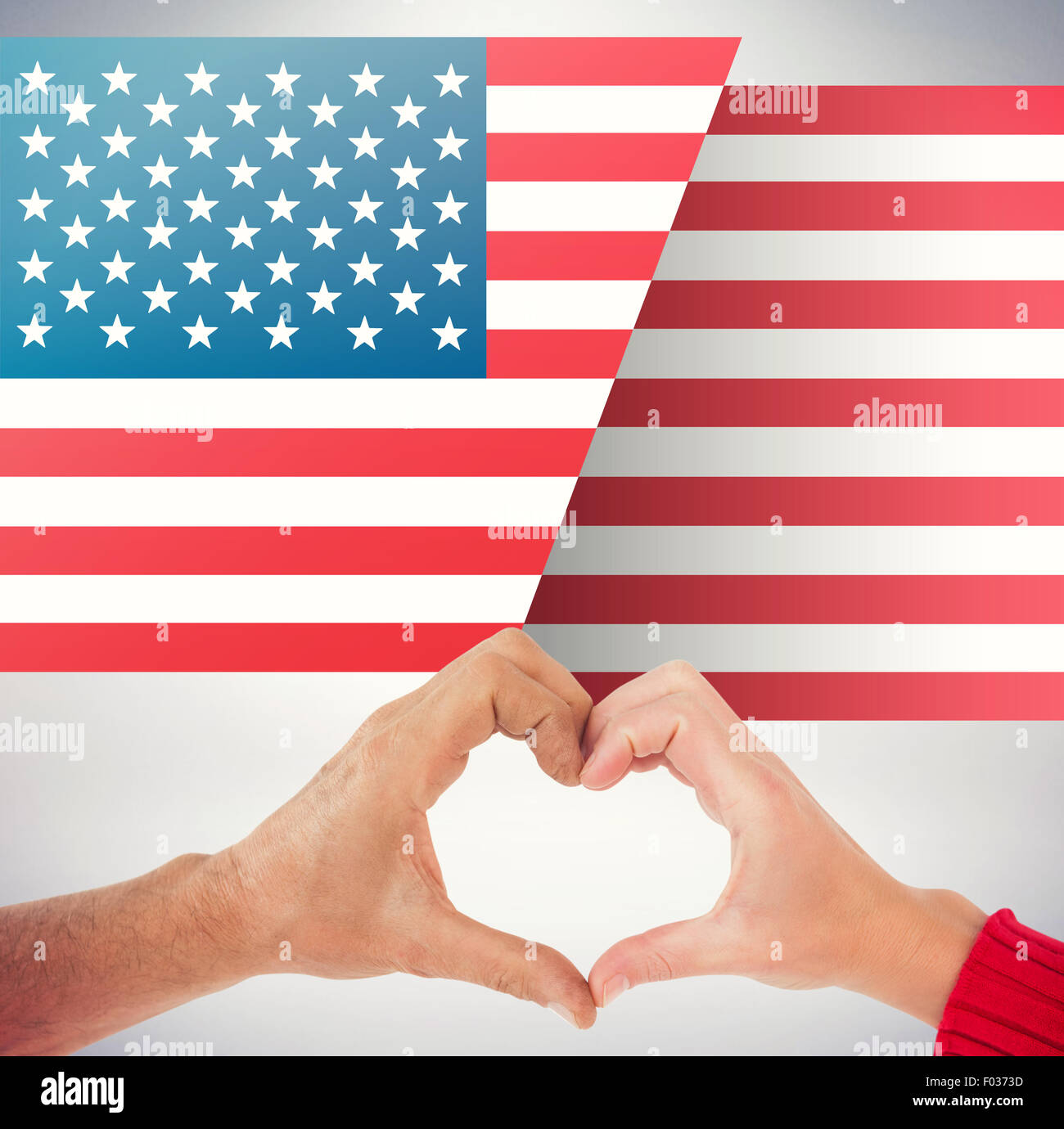 Composite image of couple making heart shape with hands Stock Photo - Alamy