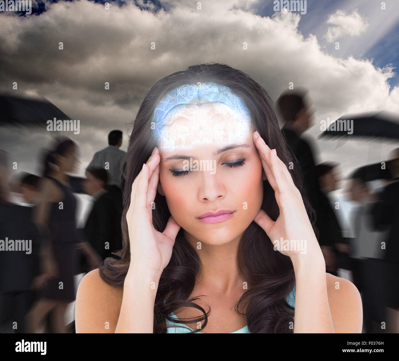 Composite image of pretty brunette with a headache Stock Photo