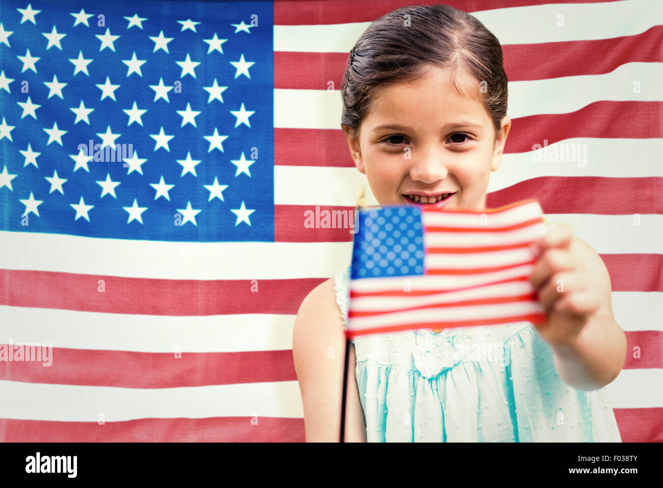 Composite image of cute girl with american flag Stock Photo