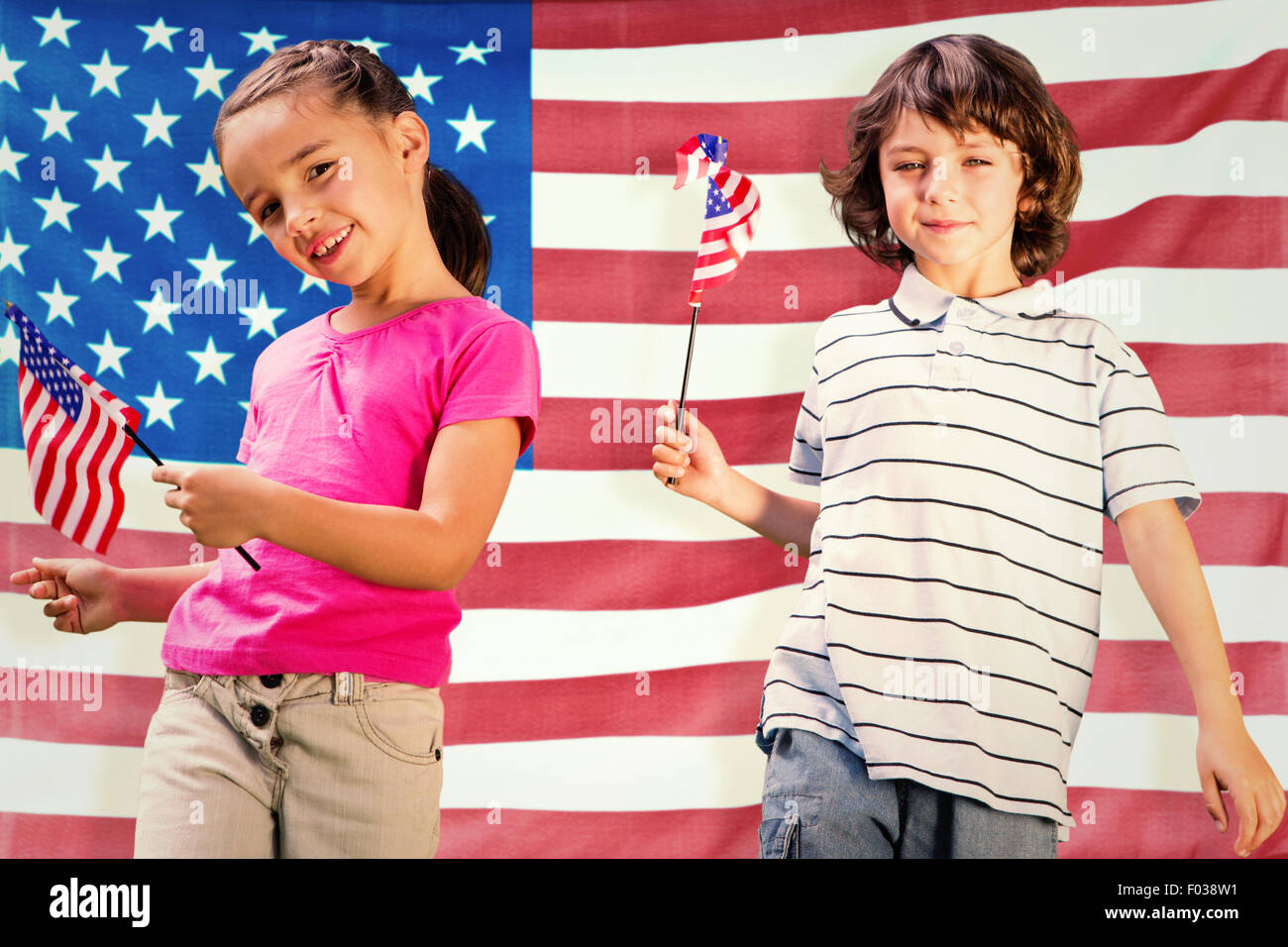 Composite image of children with american flags Stock Photo