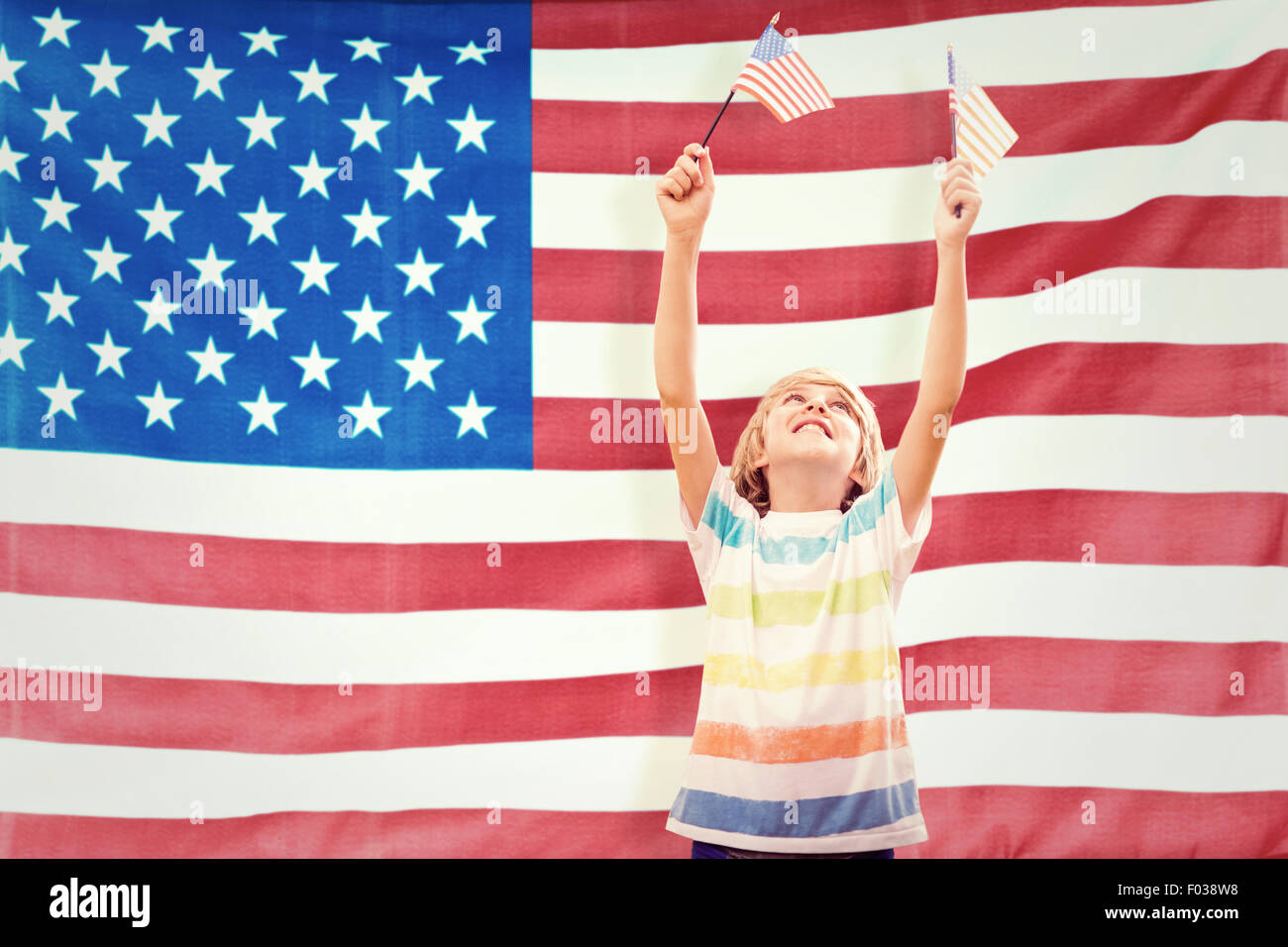 Composite image of cute boy with american flag Stock Photo
