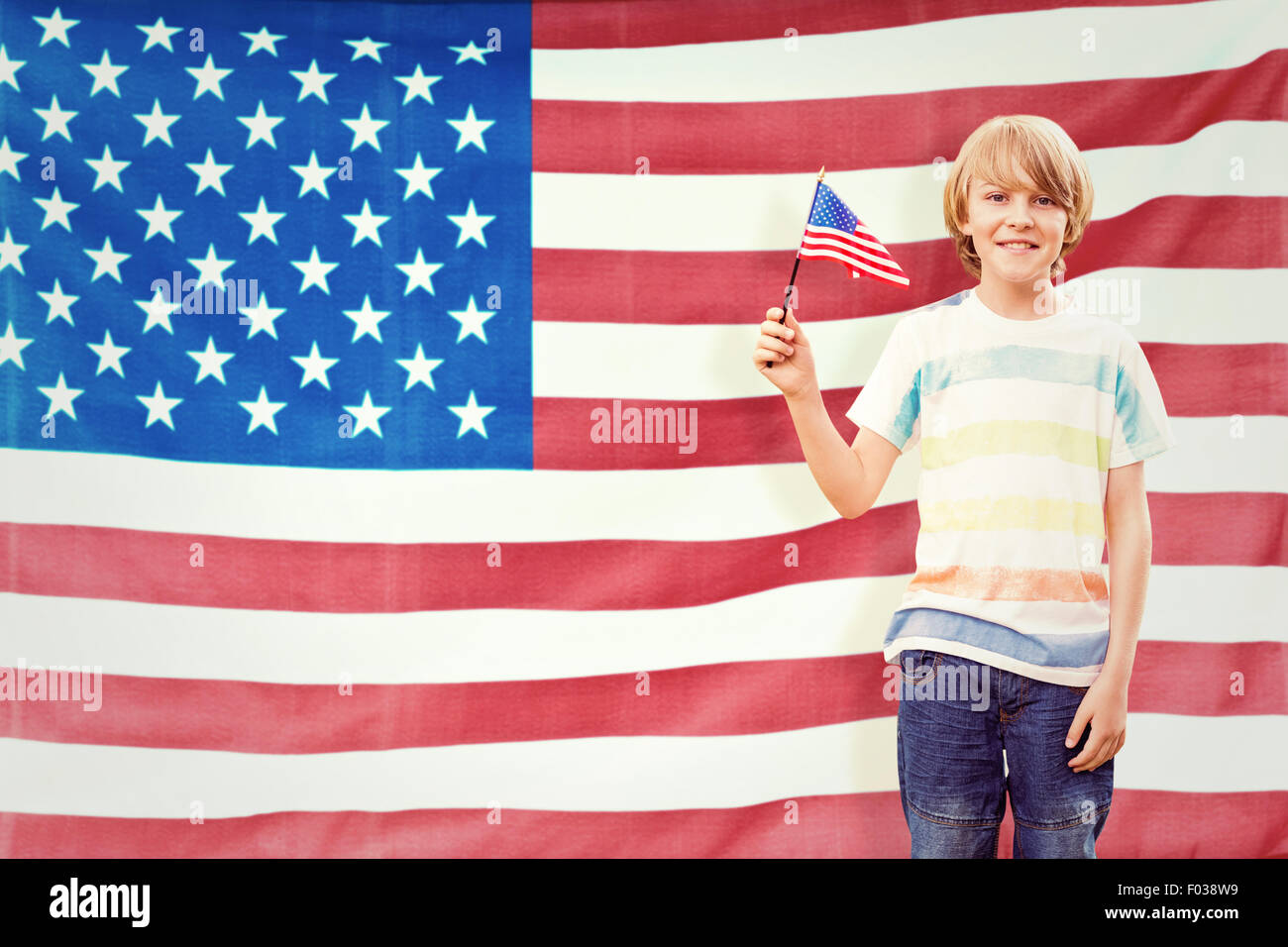 Composite image of cute boy with american flag Stock Photo