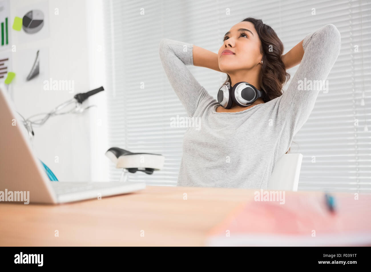 Young businesswoman relaxes in the office Stock Photo