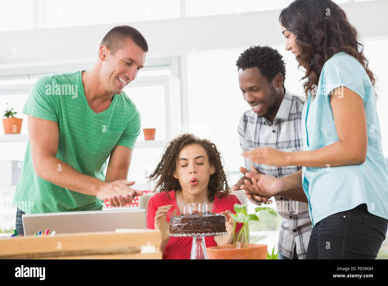 Smiling colleagues celebrating birthday Stock Photo - Alamy