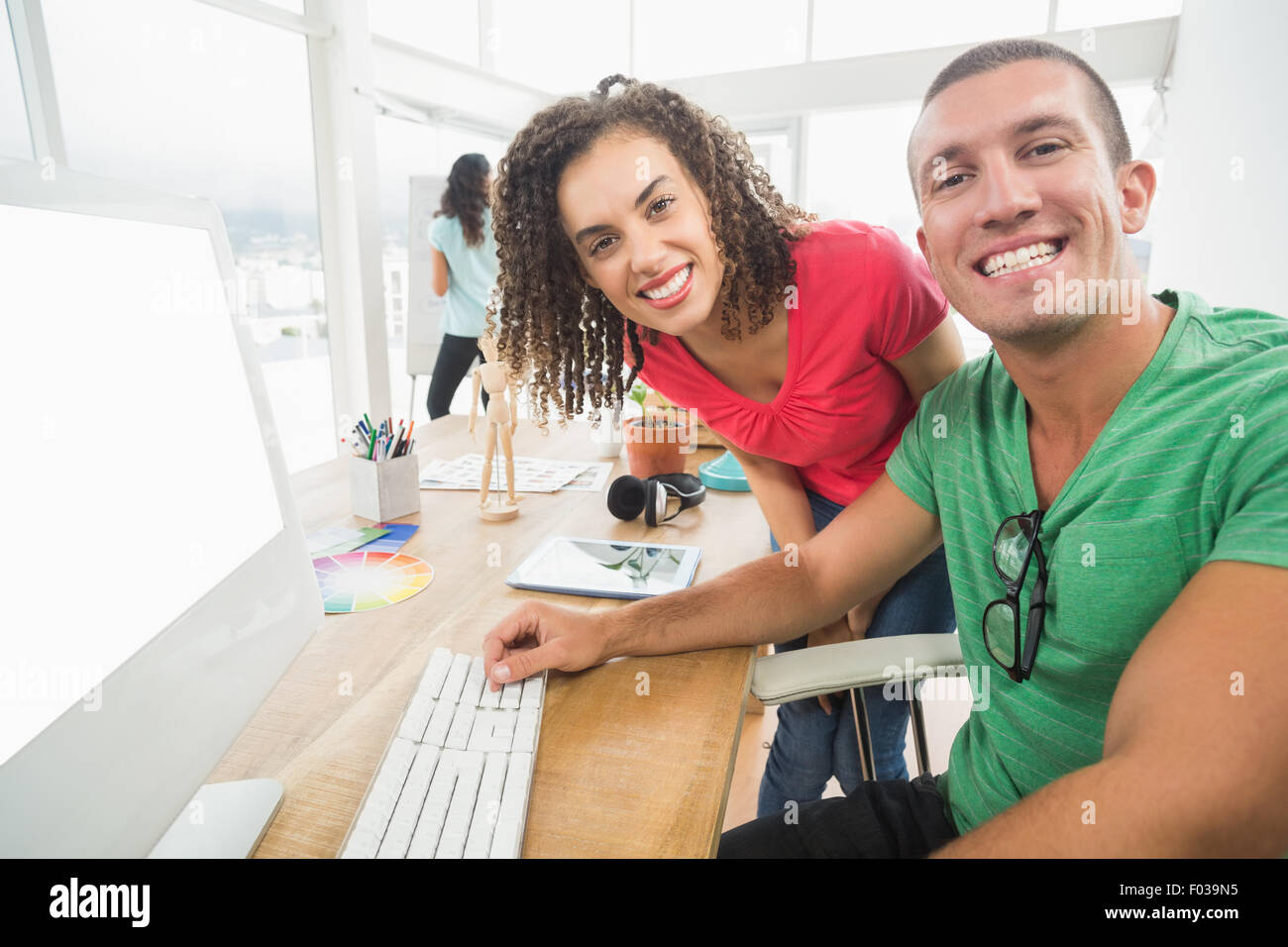 Colleague Computer Portrait colleagues using a computer Stock Photo - Alamy