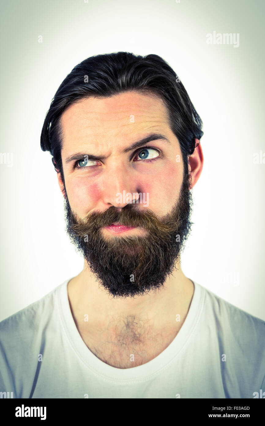 Handsome hipster thinking and looking away Stock Photo - Alamy