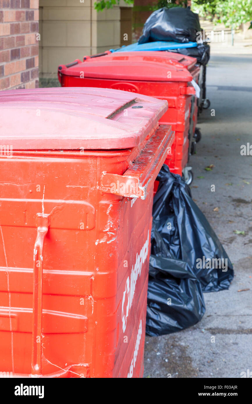 Large wheelie bins and black bags of commercial waste, Nottingham, England, UK Stock Photo