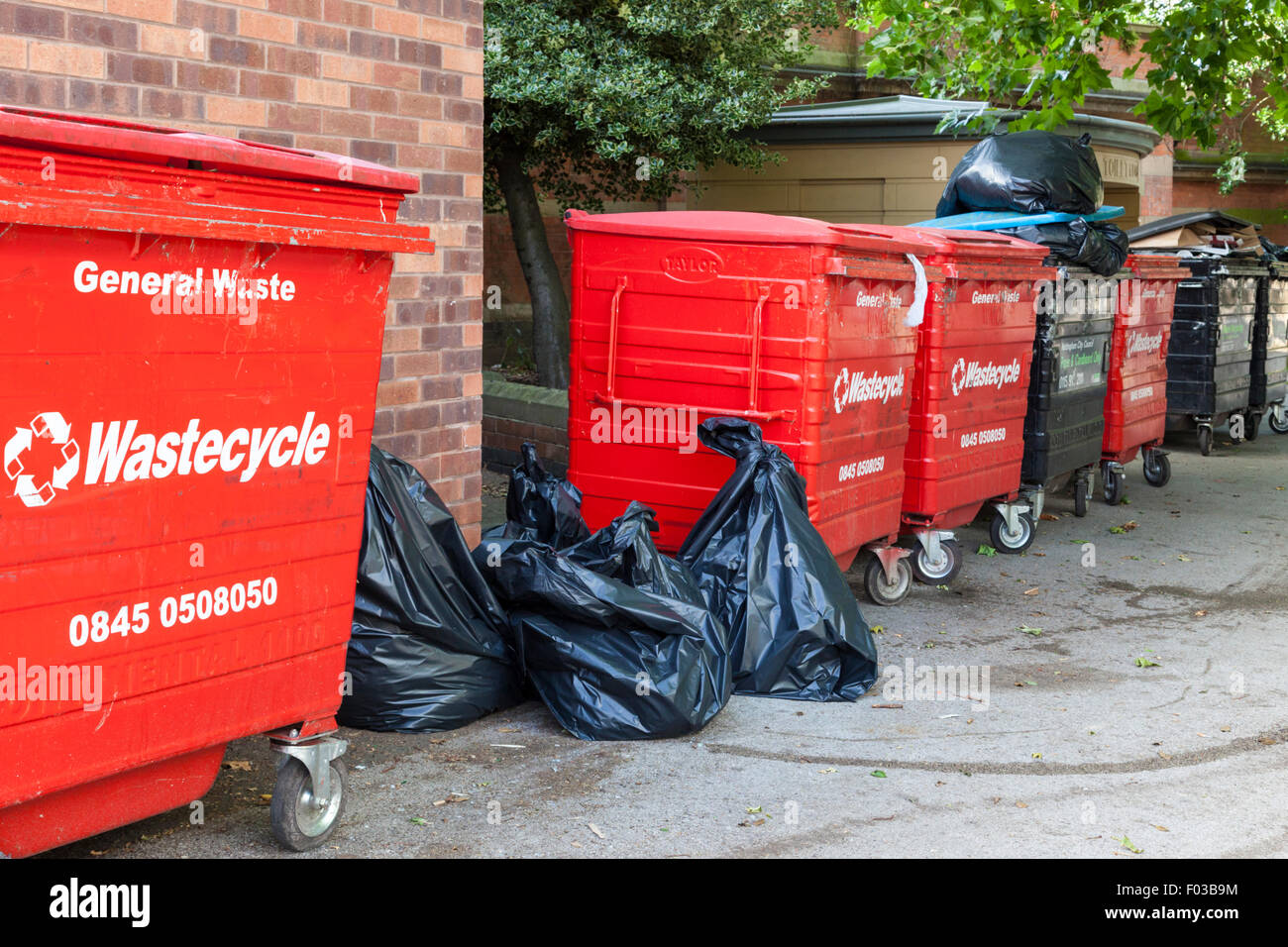 Large Wastecycle wheelie bins and black bags of trade or commercial waste, Nottingham, England
