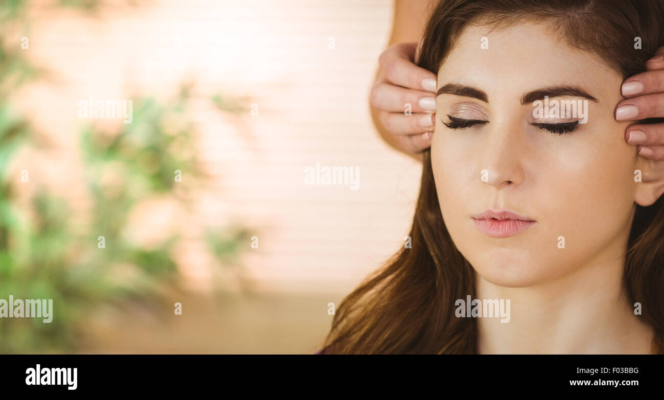 Young woman having a reiki treatment Stock Photo - Alamy