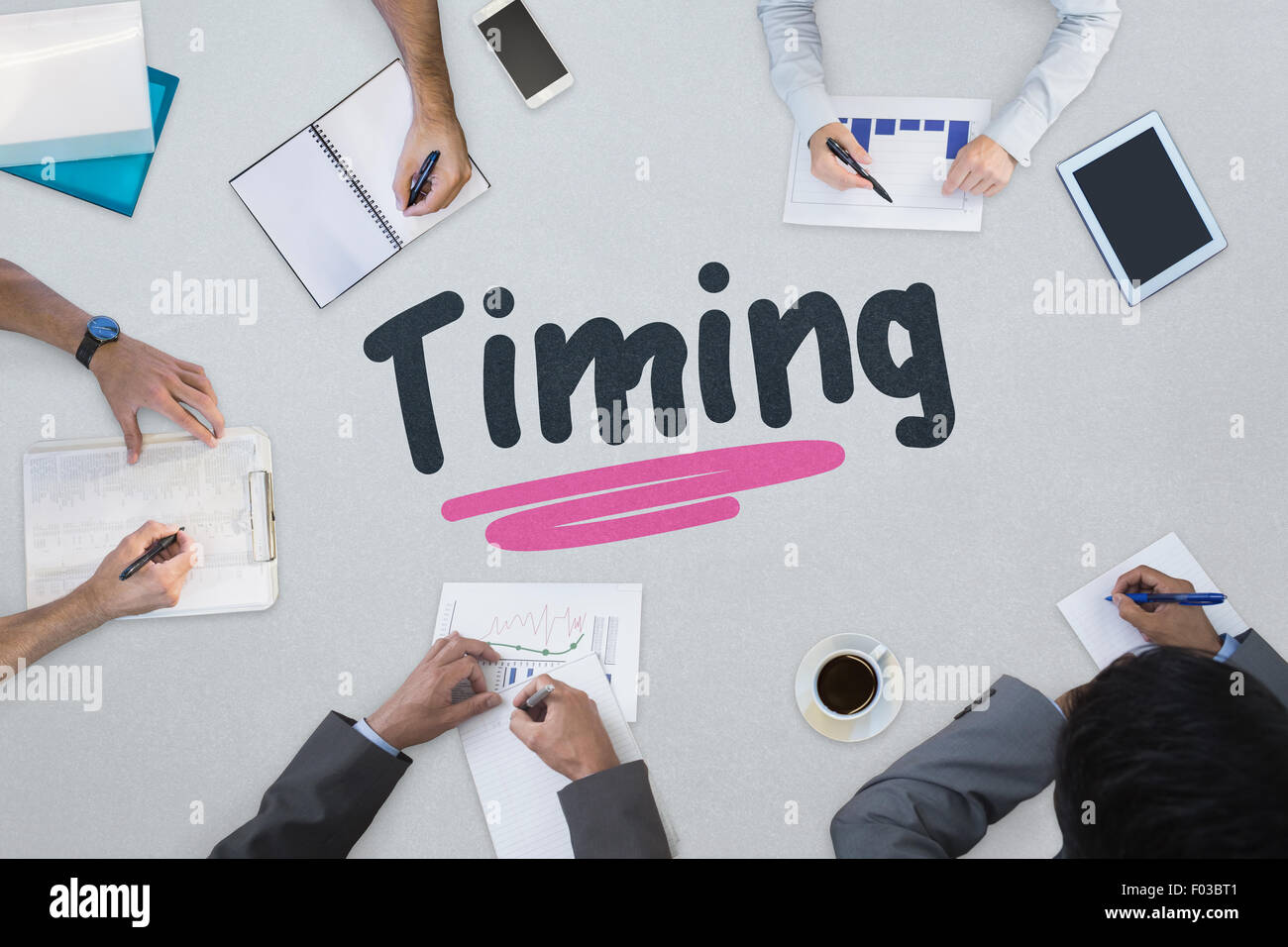 Timing against business meeting Stock Photo