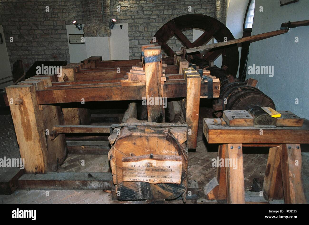 Machine with a system of multiple hammers for breaking down the fabric fibers of rags for making paper, Paper and Watermark Museum, Fabriano, Marche, Italy. Stock Photo