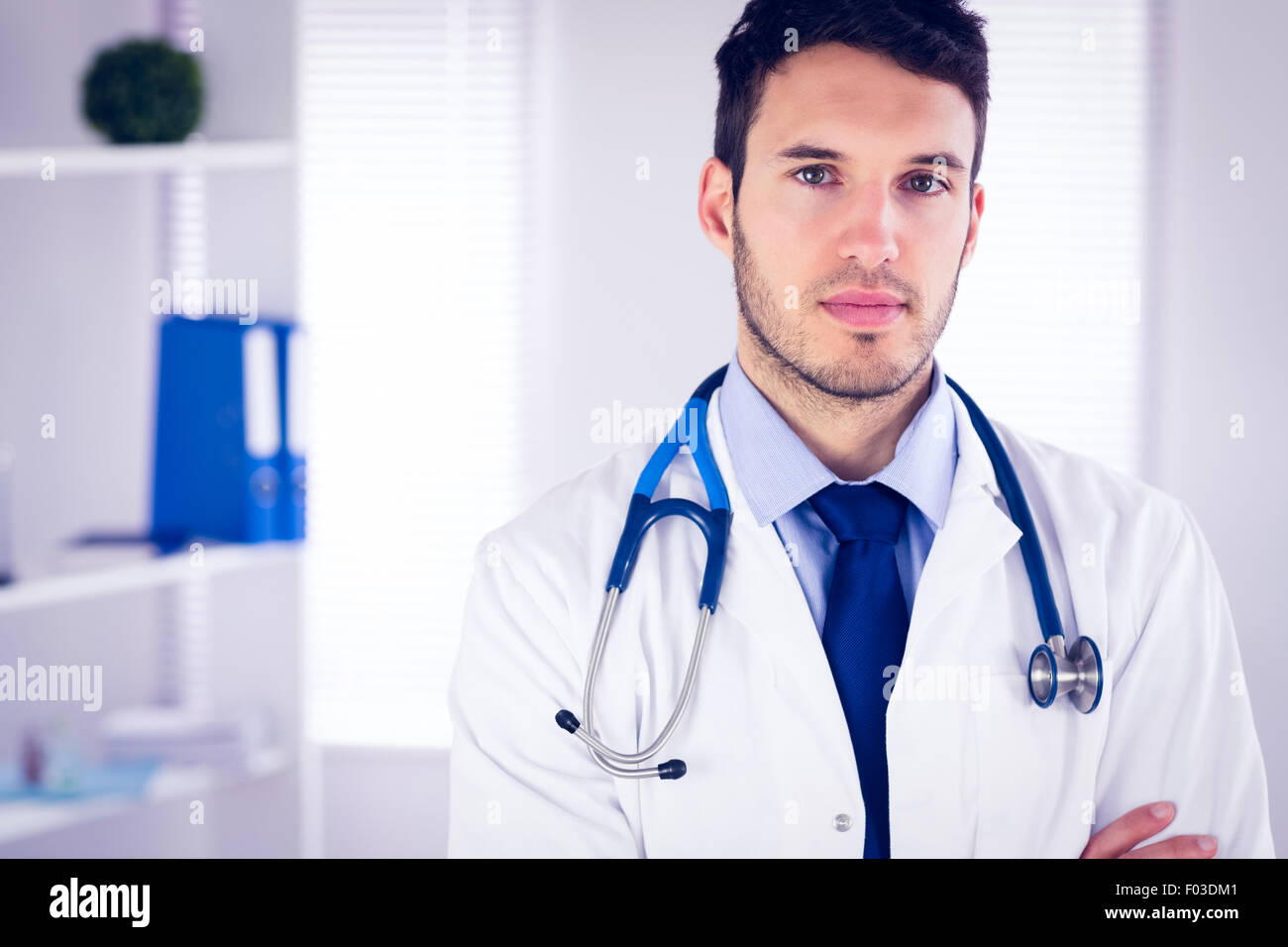Doctor portrait arms crossed hi-res stock photography and images - Alamy