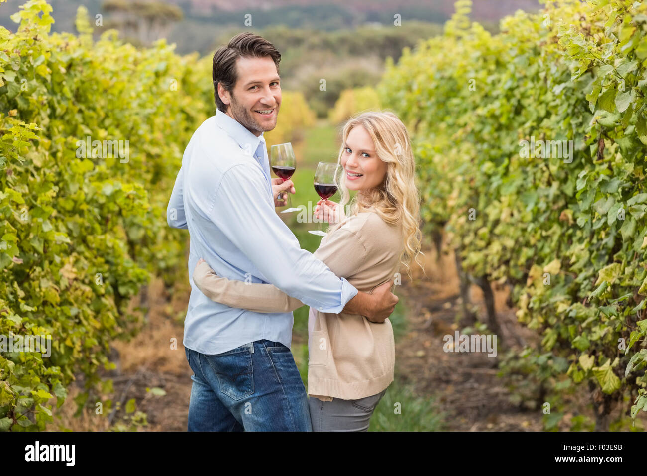 Young happy couple looking at the camera Stock Photo - Alamy