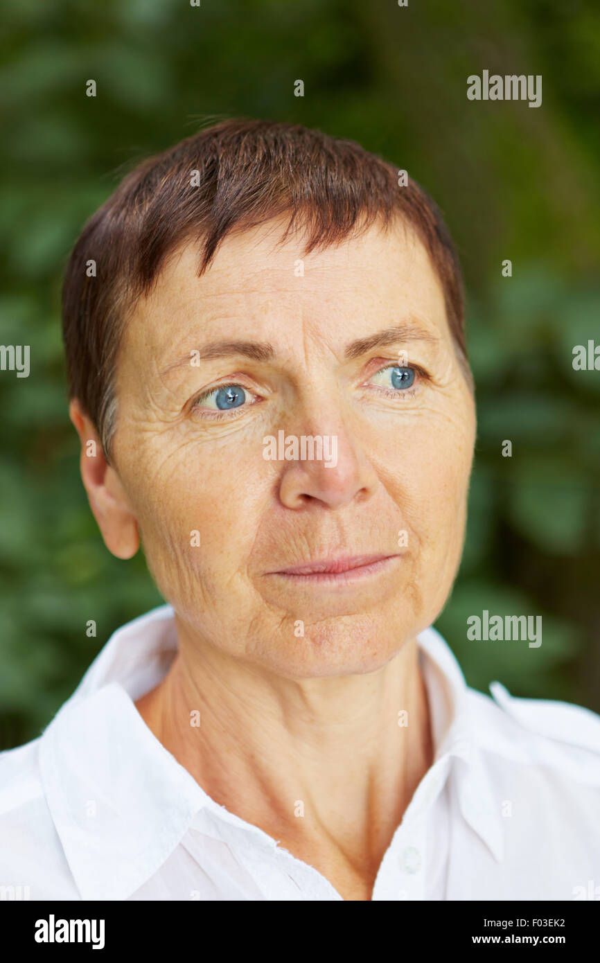 Portrait Of A Serious Old Woman With Short Hair Stock Photo