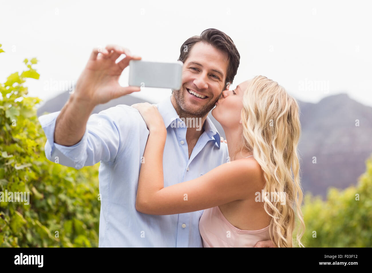 Young happy couple taking a selfie Stock Photo - Alamy