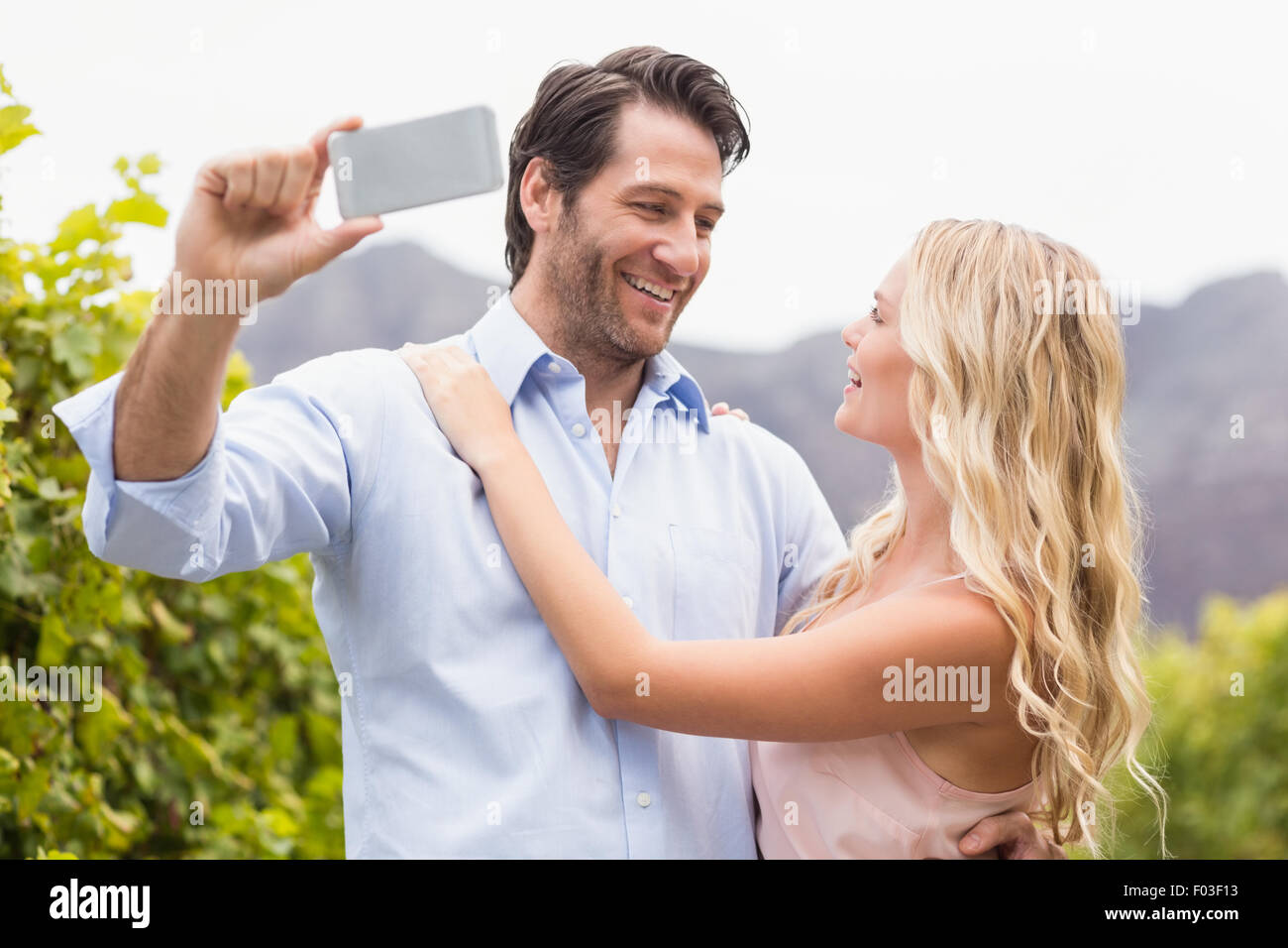 Young happy couple taking a selfie Stock Photo - Alamy