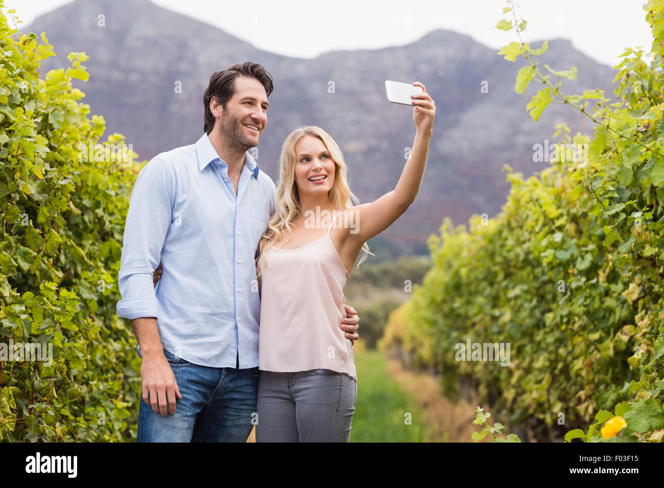 Young happy couple taking a selfie Stock Photo - Alamy