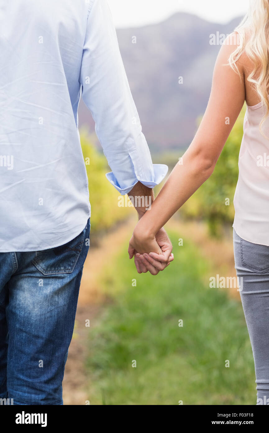 Young happy couple holding hands Stock Photo Alamy