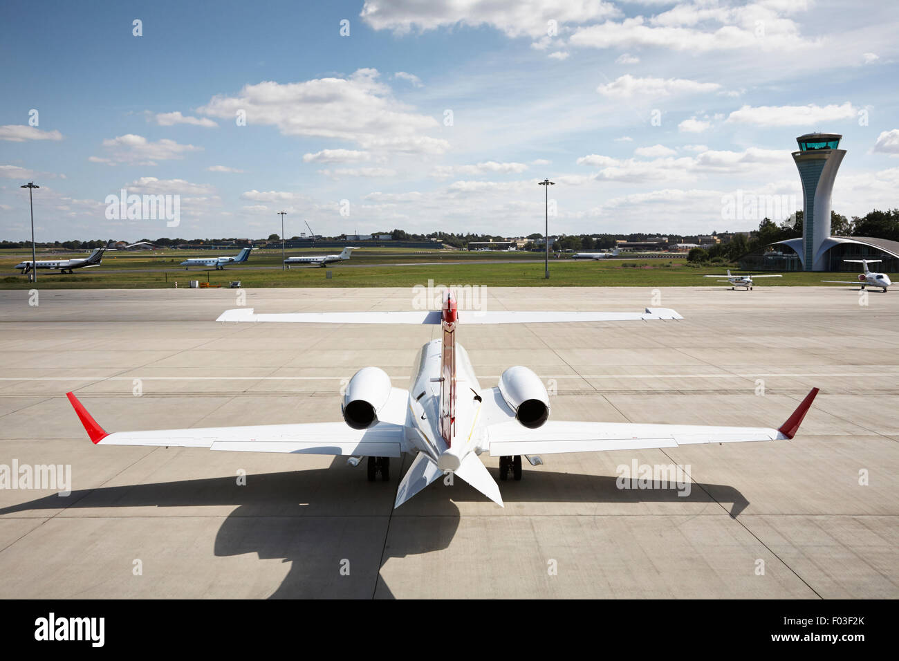 A Learjet seen from behind sits on the tarmac at Farnborough Airport. Stock Photo