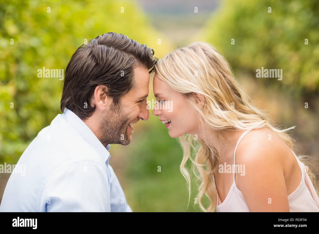 Young happy couple smiling at each other Stock Photo - Alamy