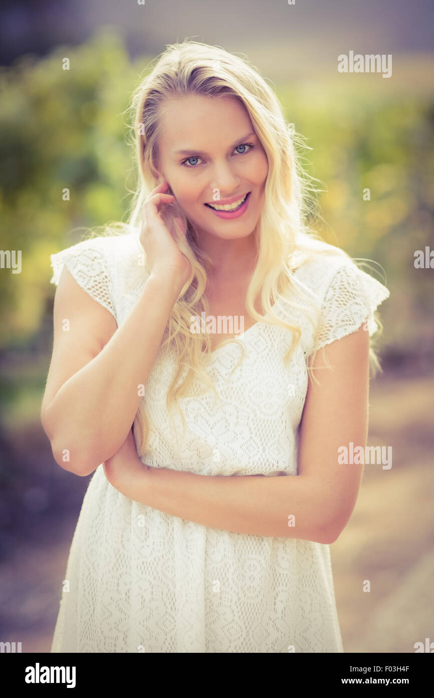 Pretty blonde woman looking at the camera Stock Photo - Alamy