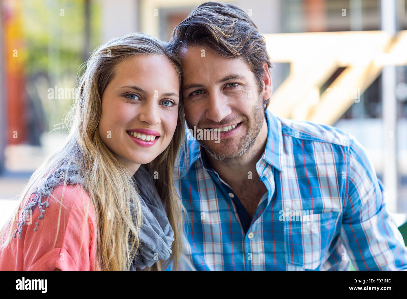 Smiling couple having tea in a cafe Stock Photo