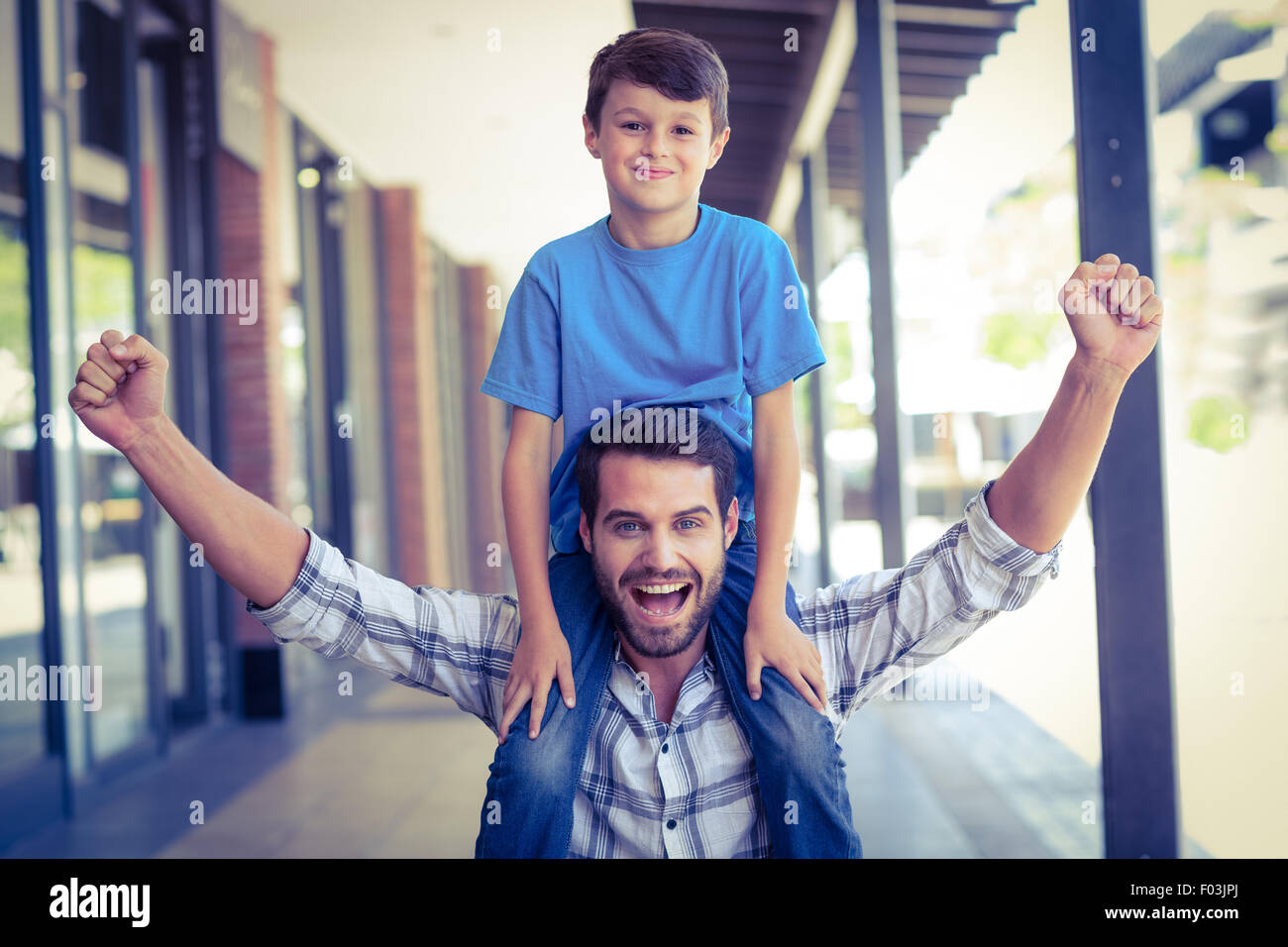 portrait of a father and son piggybacking Stock Photo