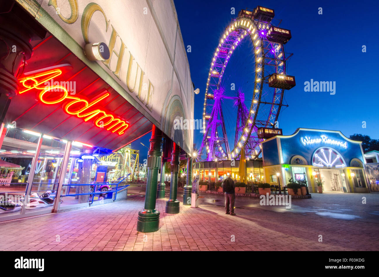 Riesenrad in Vienna with some night lights around. Stock Photo