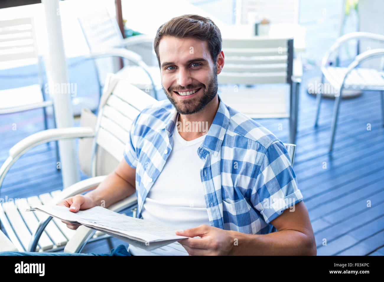 Young man reading the newspapers Stock Photo - Alamy