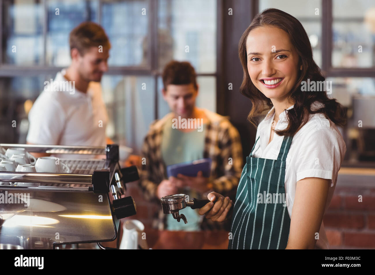 Pretty barista making a cup of coffee Stock Photo Alamy