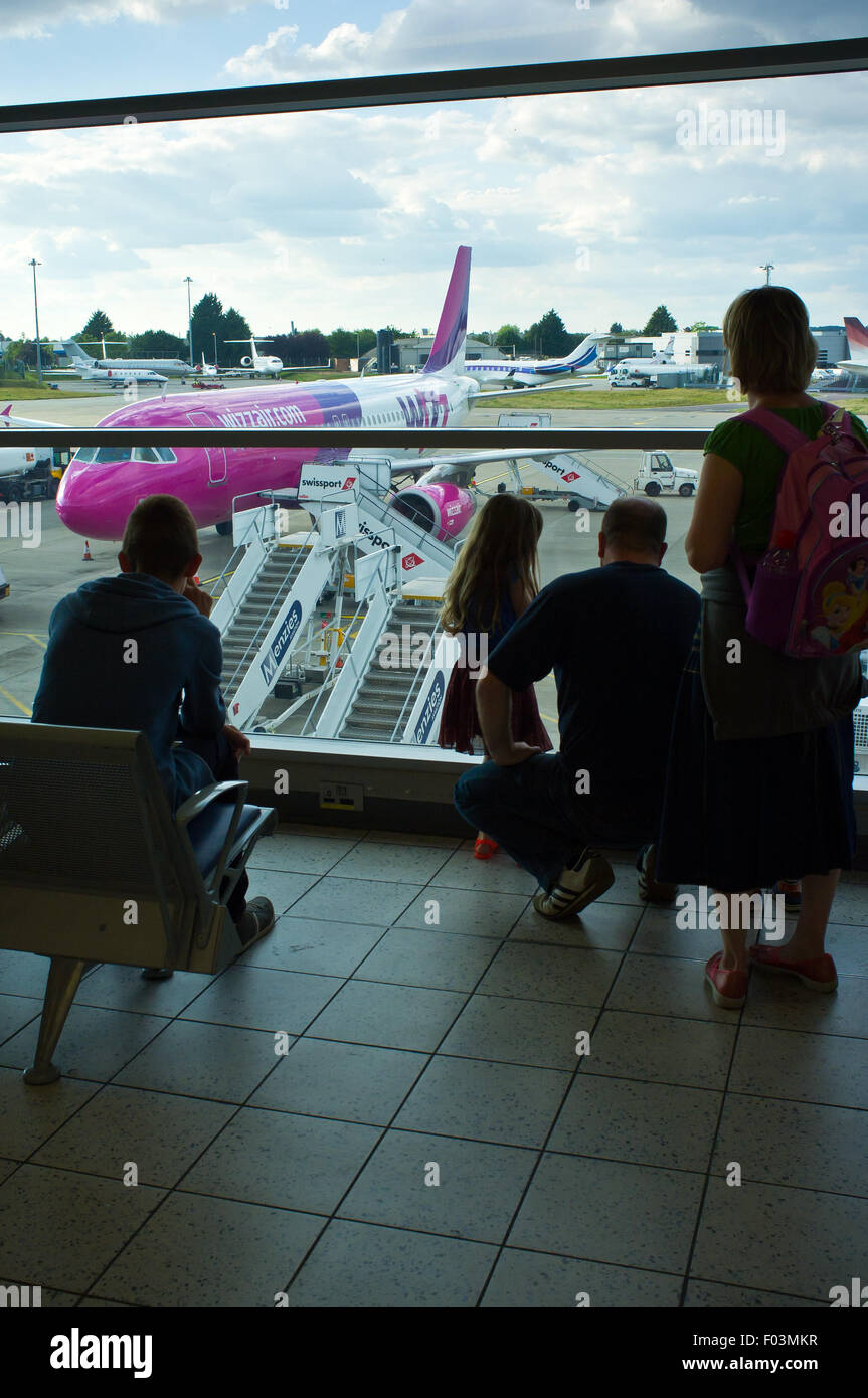 Passengers awaiting to board a Wizz Air flight to Budapest from Luton Stock Photo