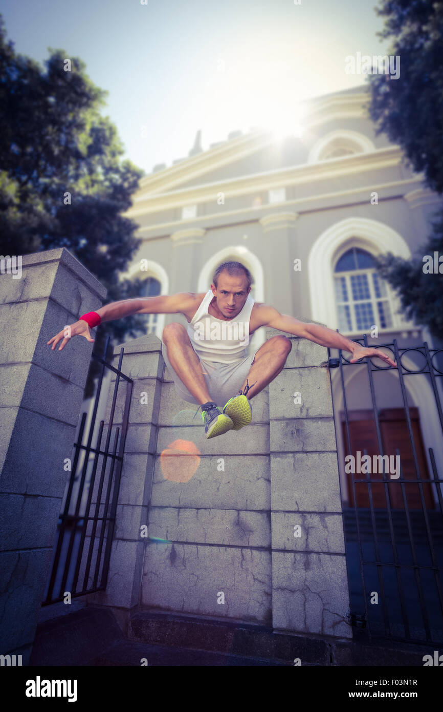 Extreme athlete jumping in front of building Stock Photo Alamy