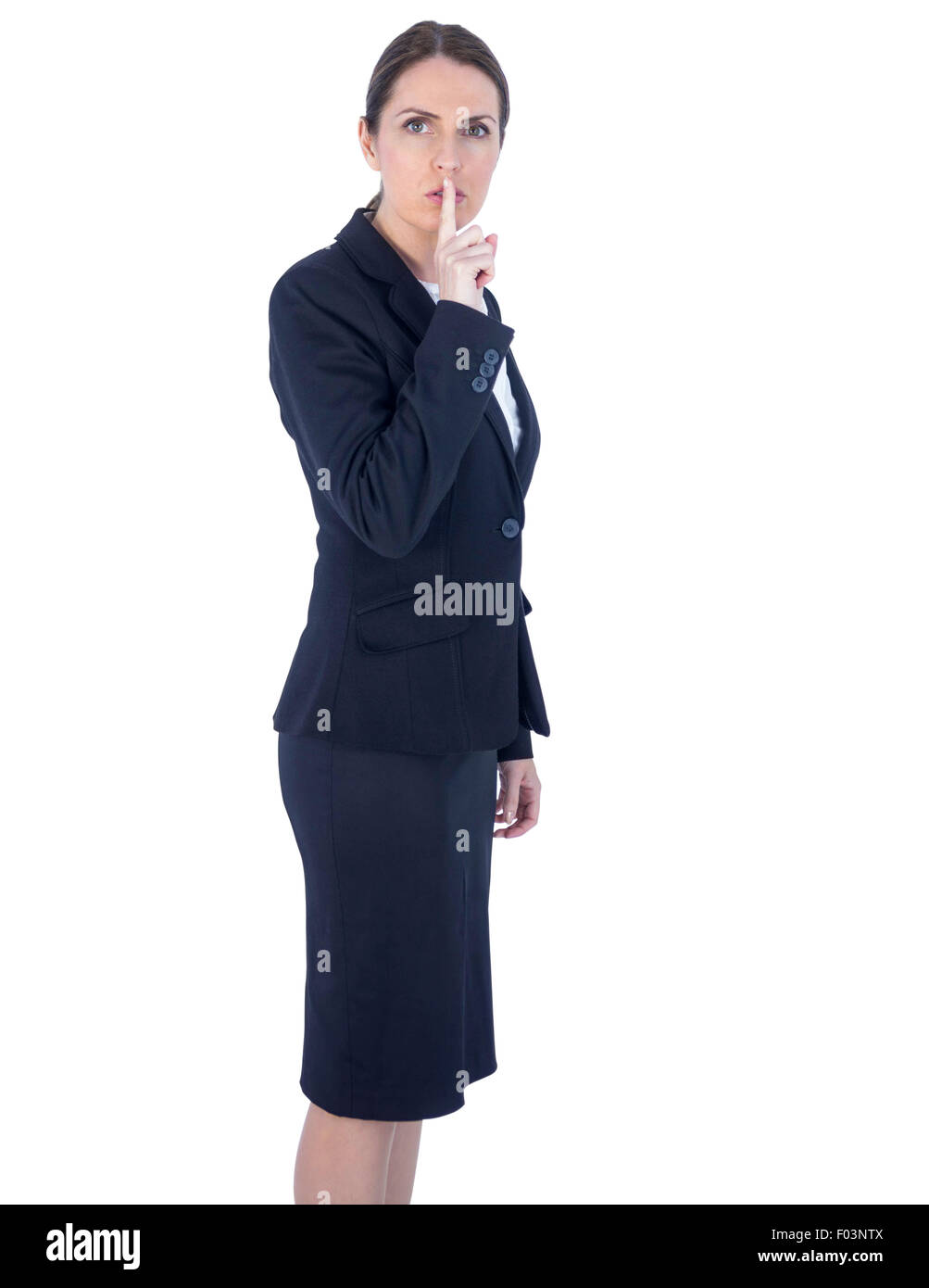 Pretty businesswoman asking for silence Stock Photo