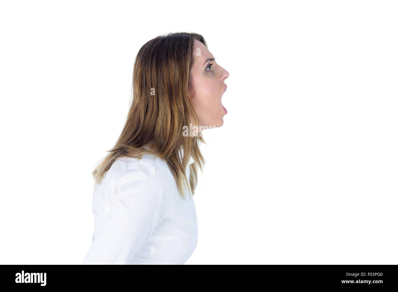 Side view of a businesswoman yelling Stock Photo