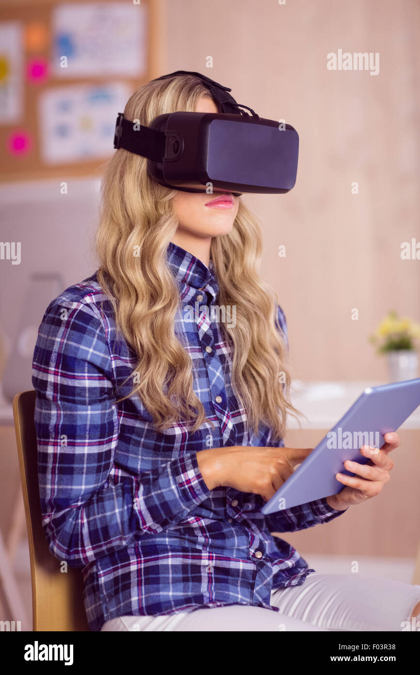 Pretty casual worker using oculus rift Stock Photo