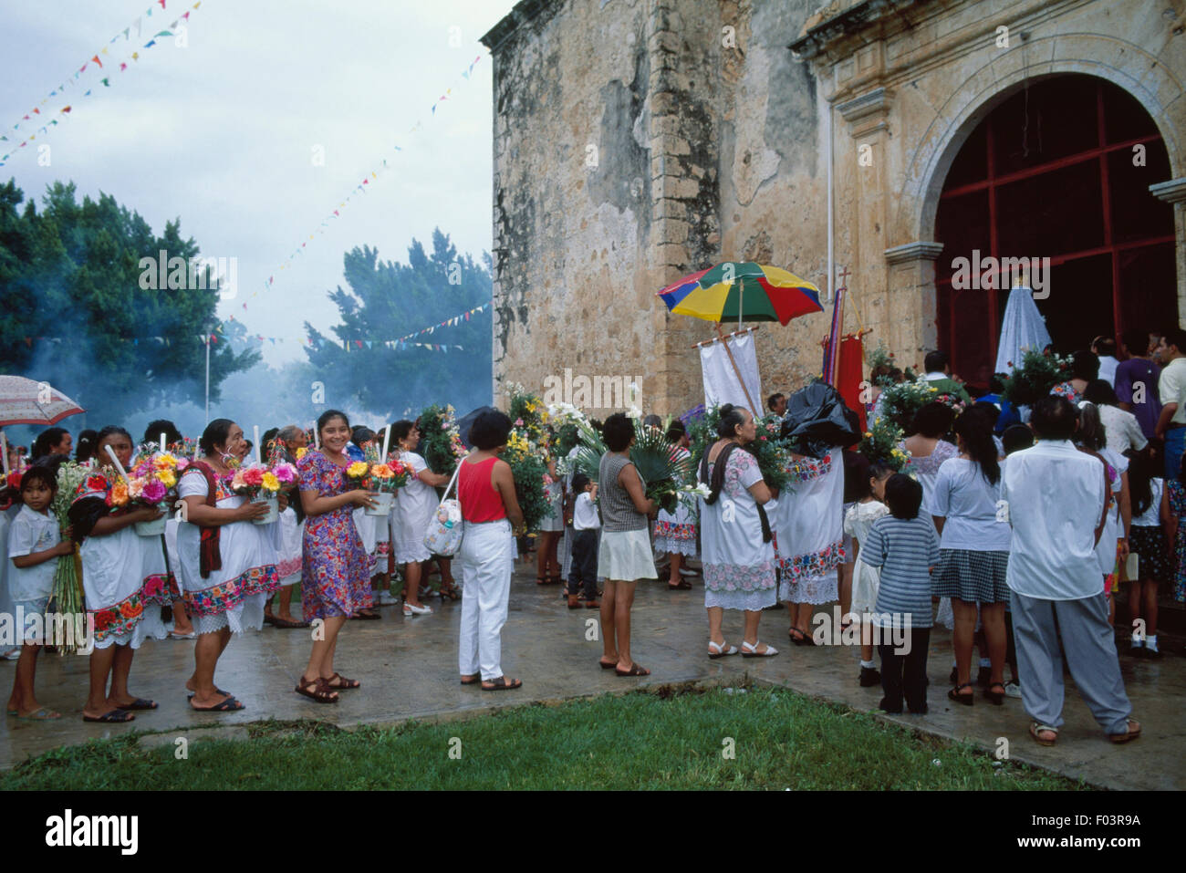 Procession outside the church during the Festival of the Birth of the Blessed Virgin Mary, Sotuta, Yucatan, Mexico. Stock Photo