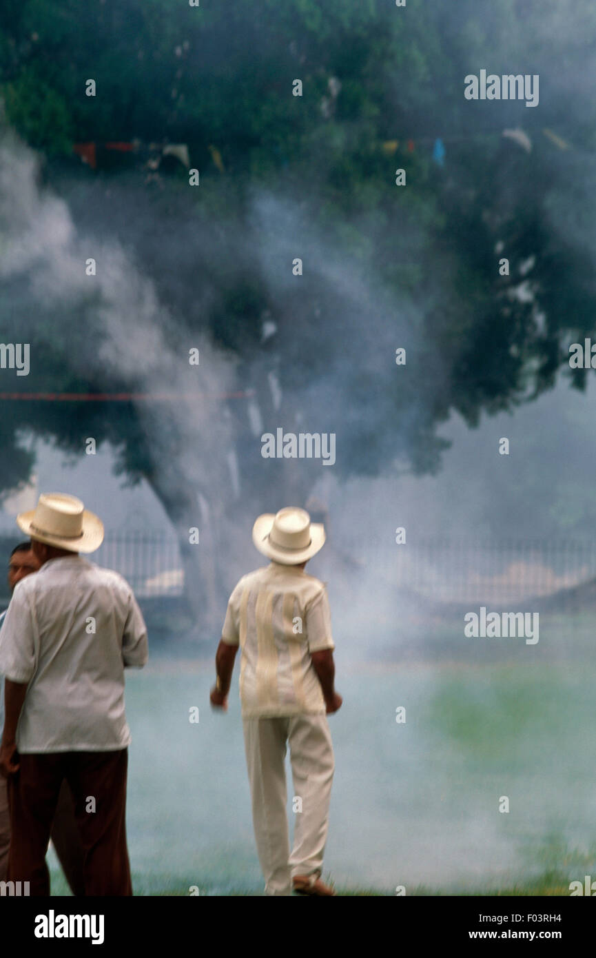 Men setting off fireworks for the Festival of the Birth of the Blessed