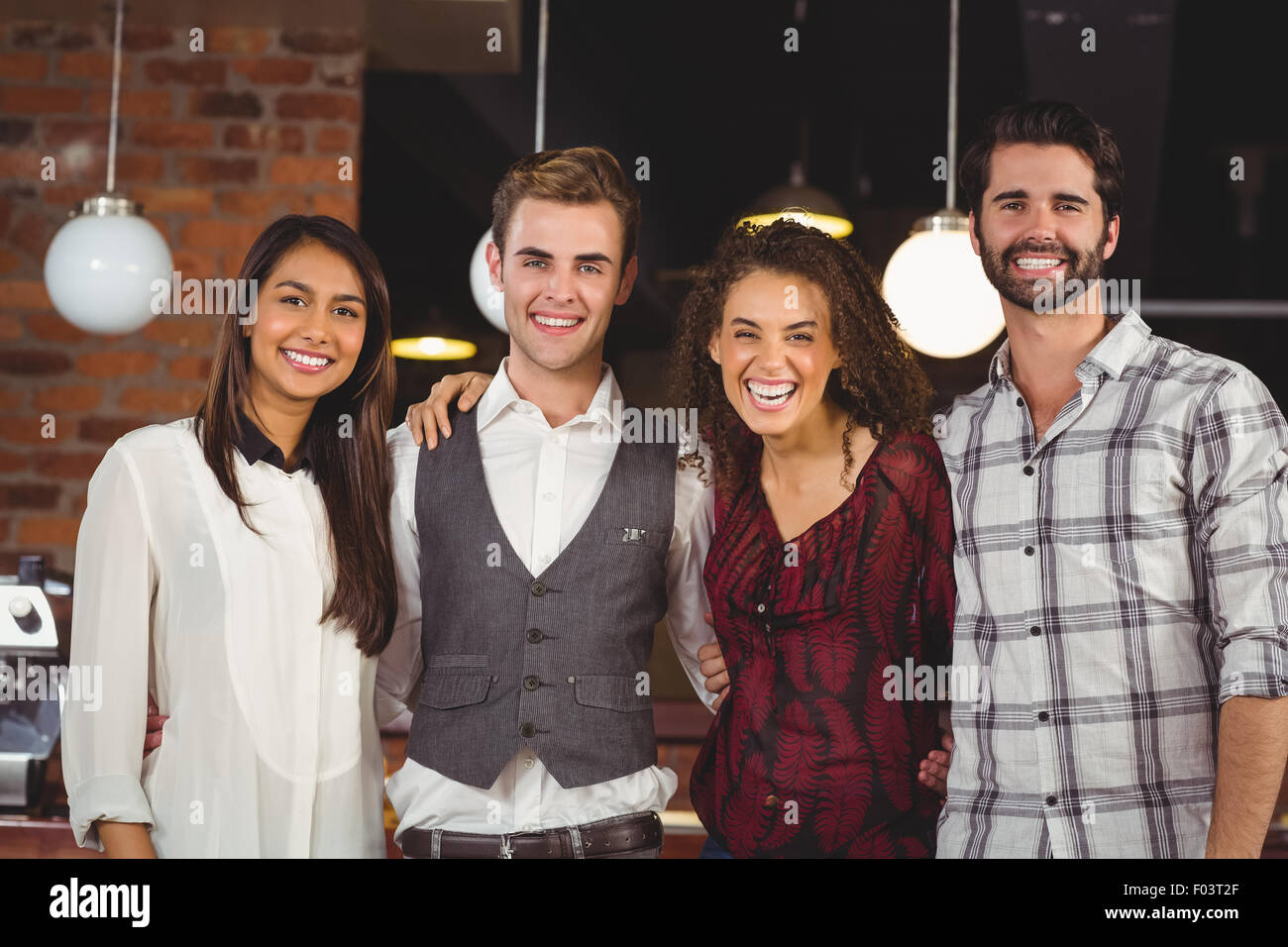 Smiling friends with arms around Stock Photo
