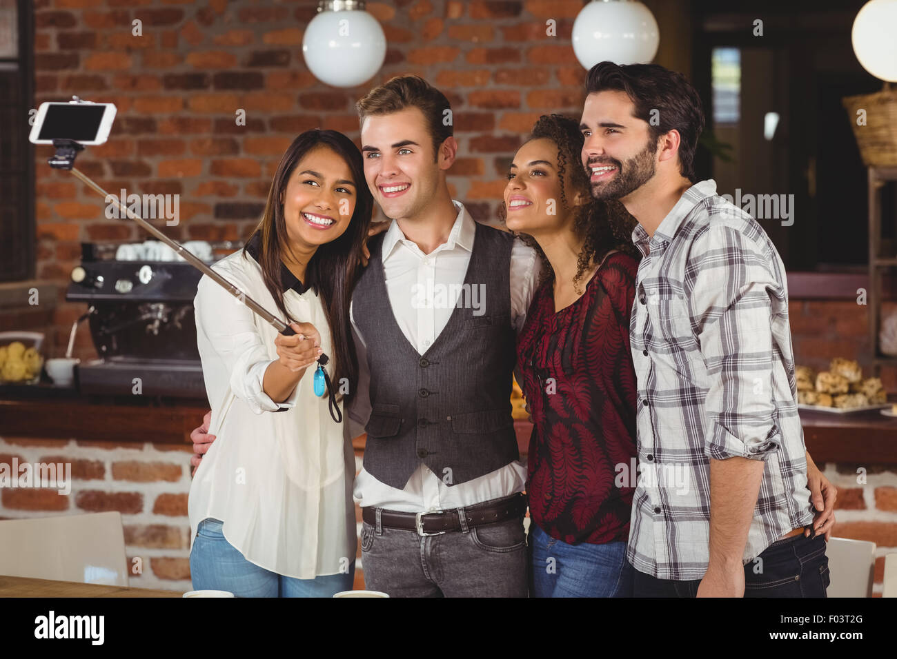 Smiling friends taking a selfie together Stock Photo