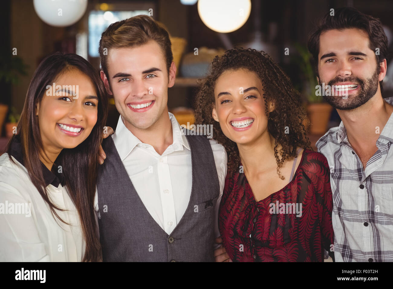 Smiling friends with arms around Stock Photo