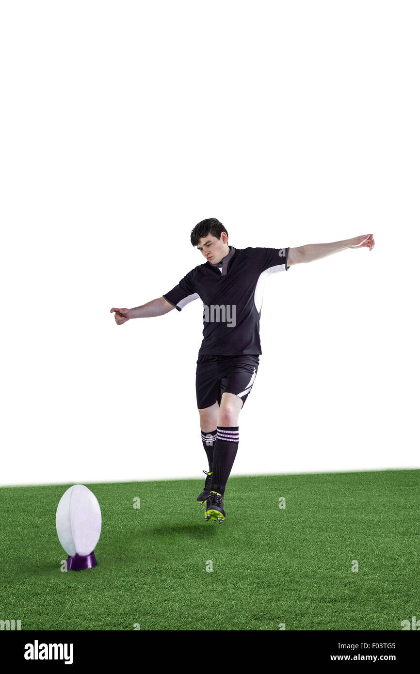 Rugby player doing a drop kick Stock Photo Alamy