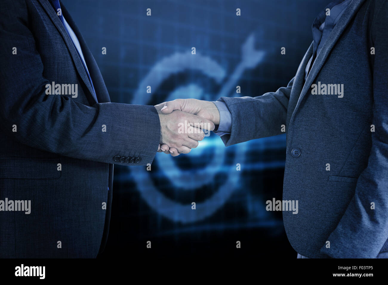 Composite image of close up on two businesspeople shaking hands Stock Photo