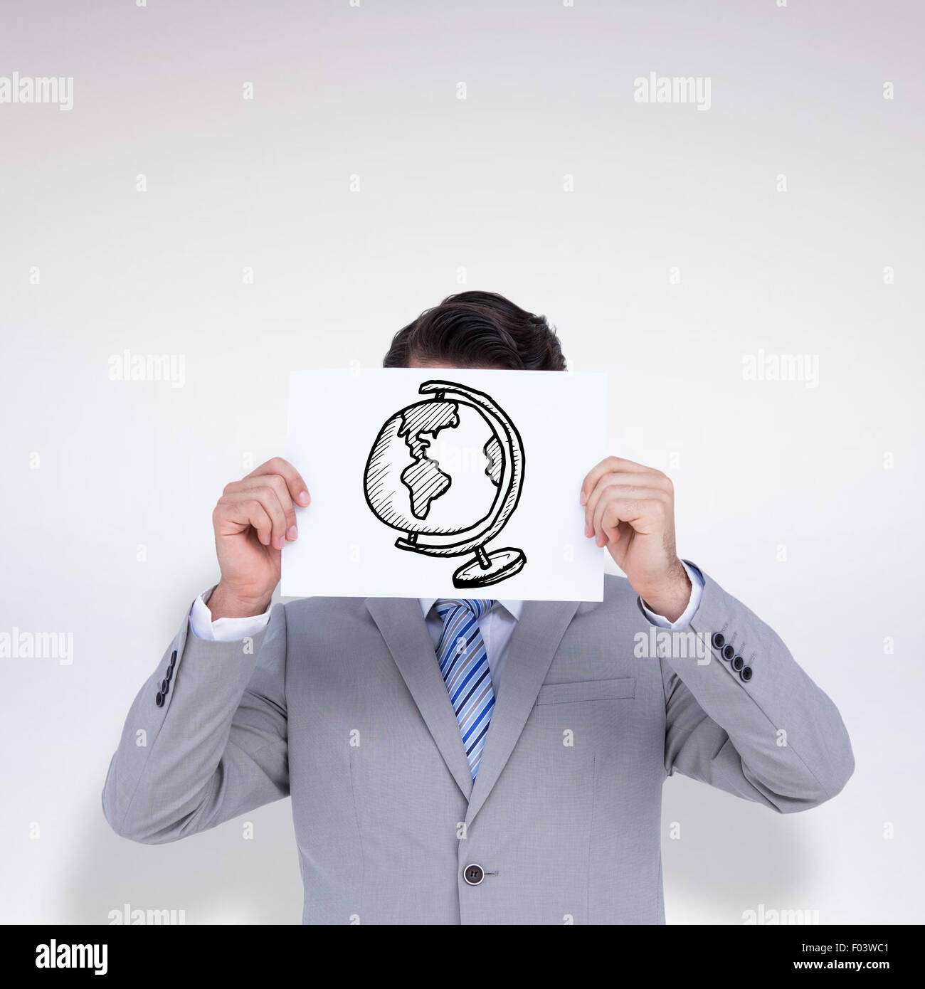 Composite image of businessman holding blank sign in front of his head Stock Photo